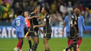 Jamaican players (left) celebrate their draw with France in the Women's World Cup tie.