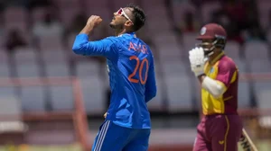 India's Axar Patel celebrates taking the wicket of West Indies Kyle Mayers.