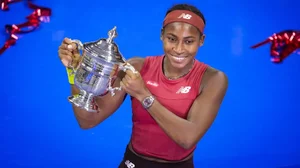 Coco Gauff poses with her US Open Championship trophy.