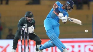 Axar Patel (R) bats during the Super 4 game against Bangladesh on Friday.