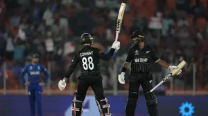 New Zealand's Devon Conway celebrates his one hundred and fifty runs with his teammate Rachin Ravind
