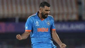 Mohammed Shami celebrates the dismissal of Mitchell Santner in Dharamsala.