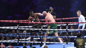 Tyson Fury, the WBC and lineal heavyweight champion (r), fights Francis Ngannou, of Cameroon