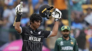 Rachin Ravindra raises his bat after scoring yet another ton in the WC