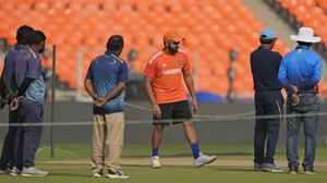India captain Rohit Sharma inspecting the pitch at Narendra Modi Stadium in Ahmedabad ahead of the ODI World Cup final against Australia.
