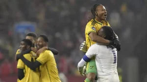 Jamaica's Bobby De Cordova-Reid (second from right) celebrates the win