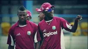 Andre Russell (L) with West Indies coach Daren Sammy (R)