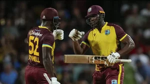 West Indies captain Rovman Powell and Andre Russell celebrating after hitting a boundary against England 