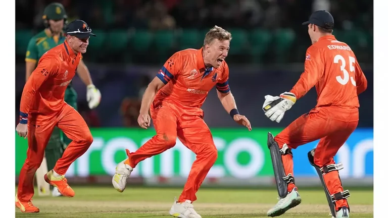 Logan van Beek celebrates with teammates after taking the wicket of David Miller during the ICC Men’s Cricket World Cup 2023 match between South Africa and Netherlands, at HPCA Stadium in Dharamsala. - null