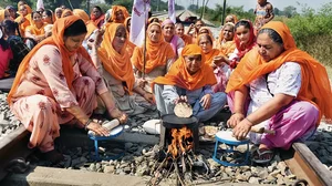 Women farmers in Amritsar making chapatis on a railway track during the ‘rail roko’ agitation in 2020 against the central government’s farm laws 