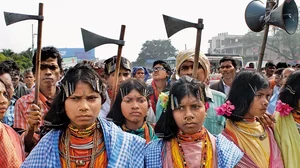 Tribal people dance in protest against the poor implementation of the Forest Rights Act in Bhubaneswar in 2016