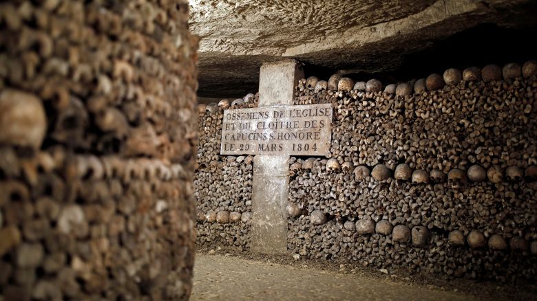 Detail of human skulls and bones which are stacked in the ossuary room in the catacombs of Paris, France, March 29, 2017. REUTERS/Benoit Tessier