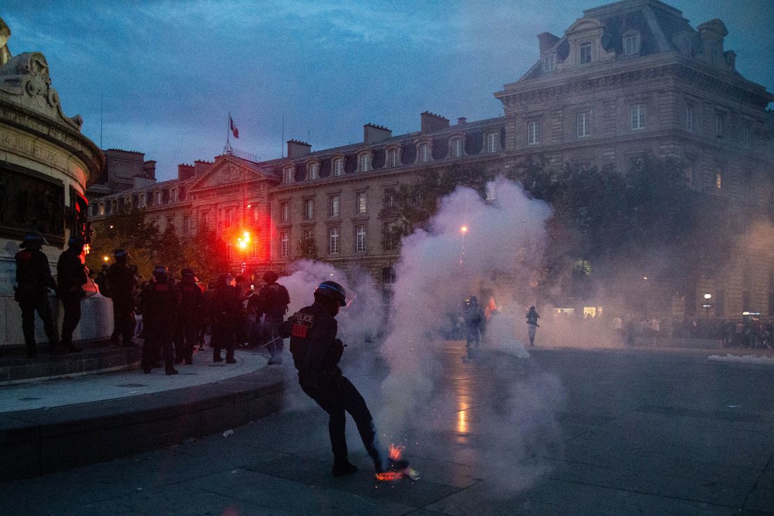 French riot police disperse demonstrators in Paris on October 12, 2023. 