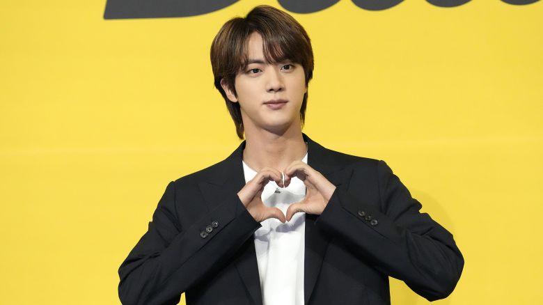 Jin, a member of South Korean K-pop band BTS poses for photographers ahead of a press conference to introduce their new single "Butter" in Seoul, South Korea, Friday, May 21, 2021. (AP Photo/Lee Jin-man)