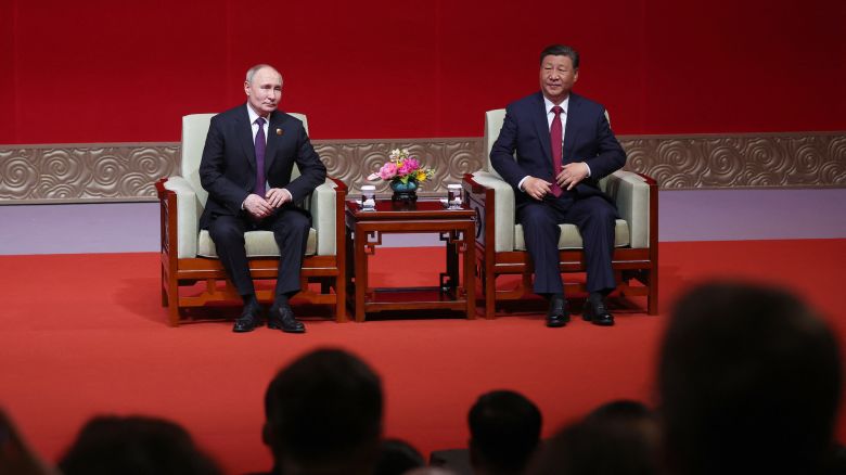 In this pool photograph distributed by the Russian state agency Sputnik, Russia's President Vladimir Putin and China's President Xi Jinping attend a concert marking the 75th anniversary of the establishment of diplomatic relations between Russia and China and opening of China-Russia Years of Culture at the National Centre for the Performing Arts in Beijing on May 16, 2024. (Photo by Alexander RYUMIN / POOL / AFP) / ** Editor's note : this image is distributed by Russian state owned agency Sputnik **
