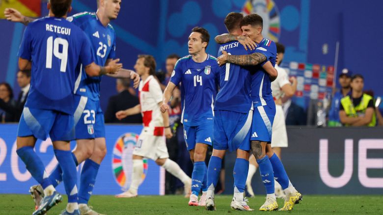 Italy's midfielder #07 Davide Frattesi (2R) celebrates with teammates at the end of the UEFA Euro 2024 Group B football match between Croatia and Italy at the Leipzig Stadium in Leipzig on June 24, 2024. (Photo by Odd ANDERSEN / AFP) (Photo by ODD ANDERSEN/AFP via Getty Images)