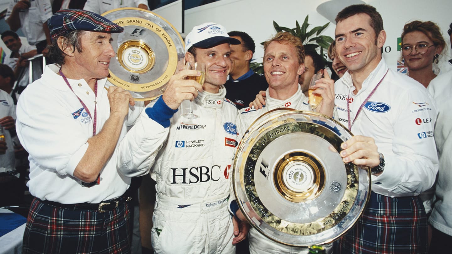 Former F1 Grand Prix World Champion Jackie Stewart ( left ) and his son Paul ( far right ), team