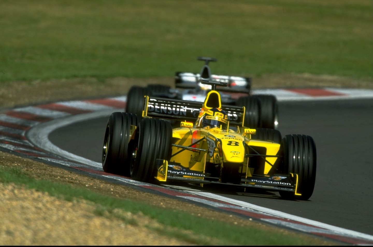 26 Sep 1999:  Heinz Harald Frentzen of Germany races the Jordan ahead of Mika Hakkinen of Mercedes