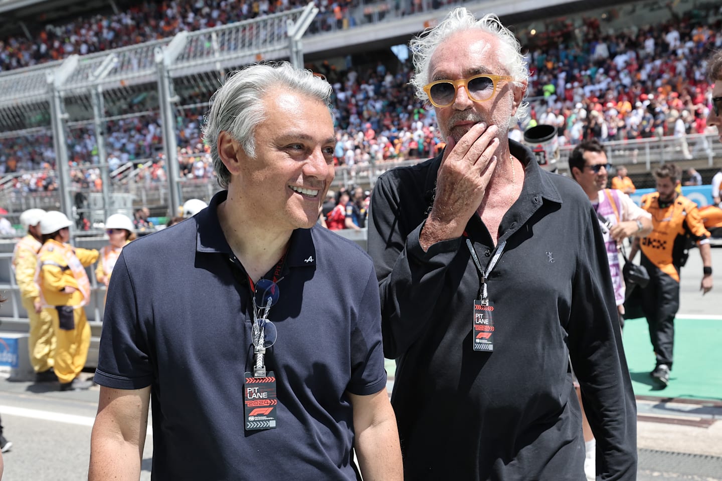 Renault's CEO Luca De Meo and Alpine Executive Advisor Flavio Briatore talk on the grid prior the