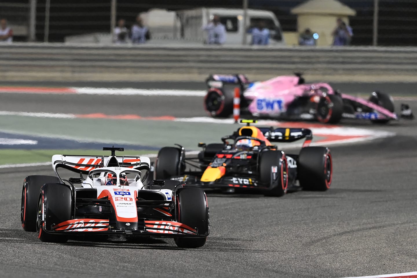 Haas' Danish driver Kevin Magnussen (foreground) drives during the Bahrain Formula One Grand Prix