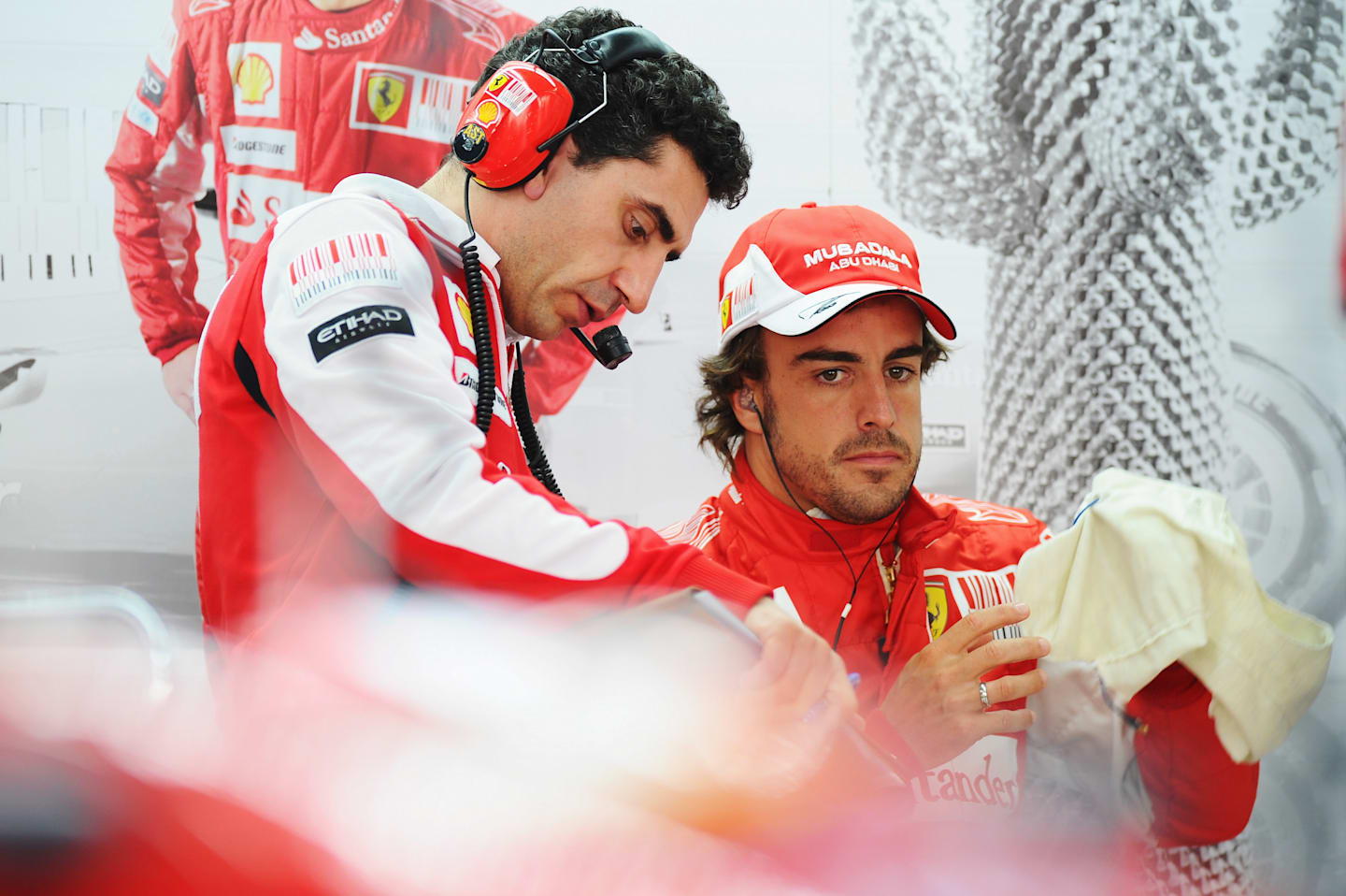 YEONGAM GUN, SOUTH KOREA - OCTOBER 22:  Fernando Alonso of Spain and Ferrari talks with his race