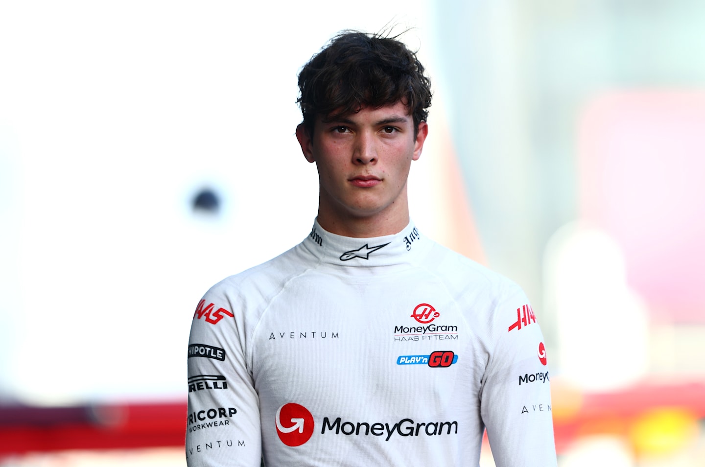 BAKU, AZERBAIJAN - SEPTEMBER 14: 11th placed qualifier Oliver Bearman of Great Britain and Haas F1 walks in the Pitlane during qualifying ahead of the F1 Grand Prix of Azerbaijan at Baku City Circuit on September 14, 2024 in Baku, Azerbaijan. (Photo by Clive Rose - Formula 1/Formula 1 via Getty Images)