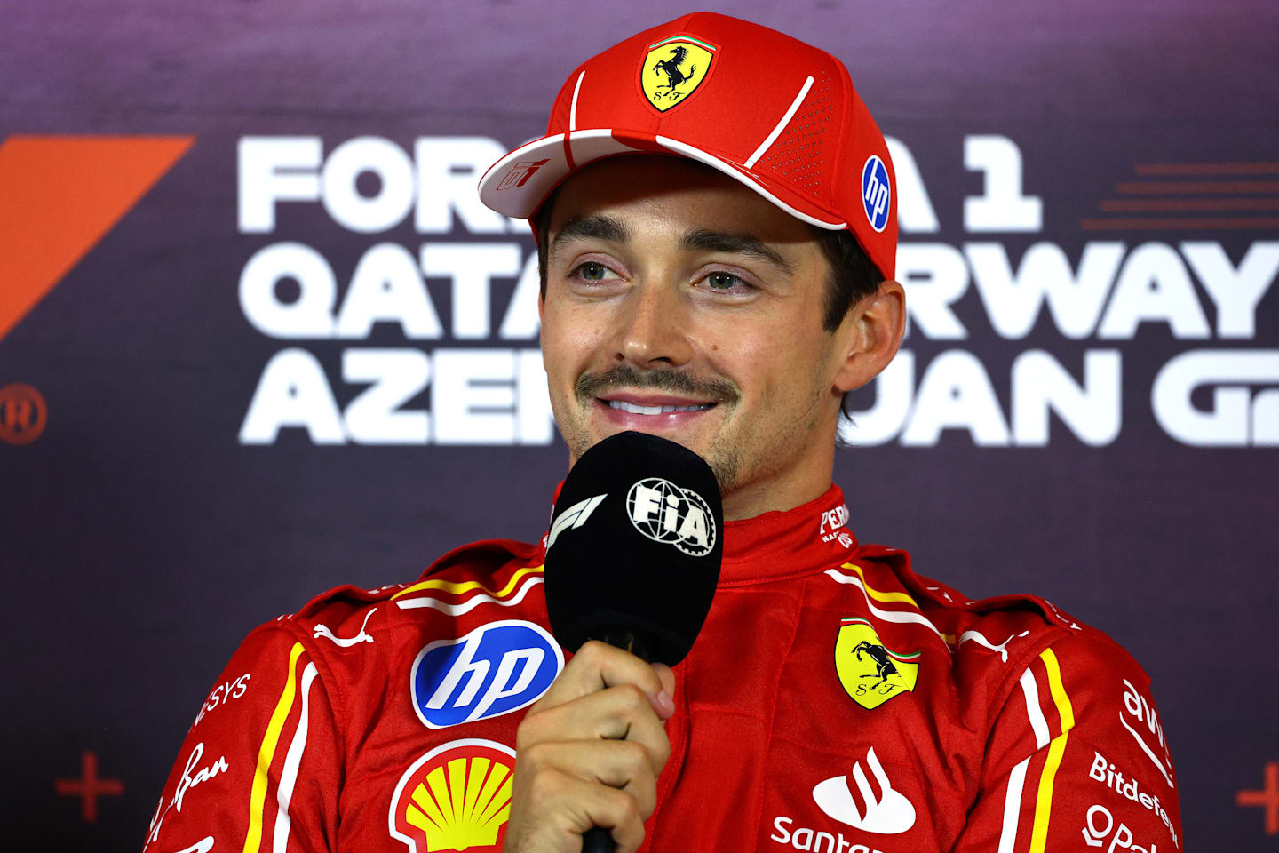 BAKU, AZERBAIJAN - SEPTEMBER 14: Pole position qualifier Charles Leclerc of Monaco and Ferrari attends the press conference after qualifying ahead of the F1 Grand Prix of Azerbaijan at Baku City Circuit on September 14, 2024 in Baku, Azerbaijan. (Photo by Clive Rose/Getty Images)