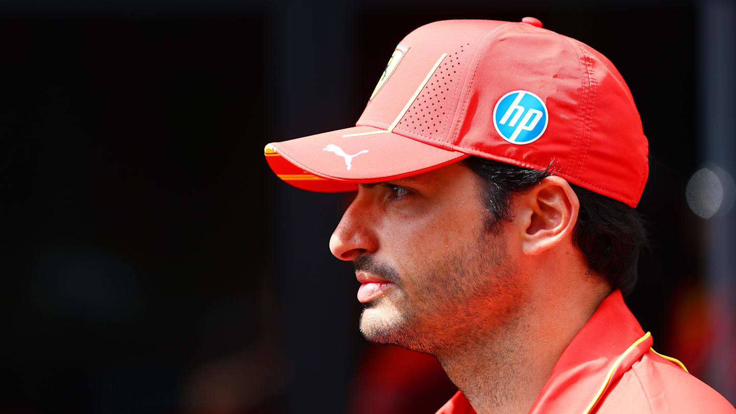 SPA, BELGIUM - JULY 25: Carlos Sainz of Spain and Ferrari talks to the media in the Paddock during