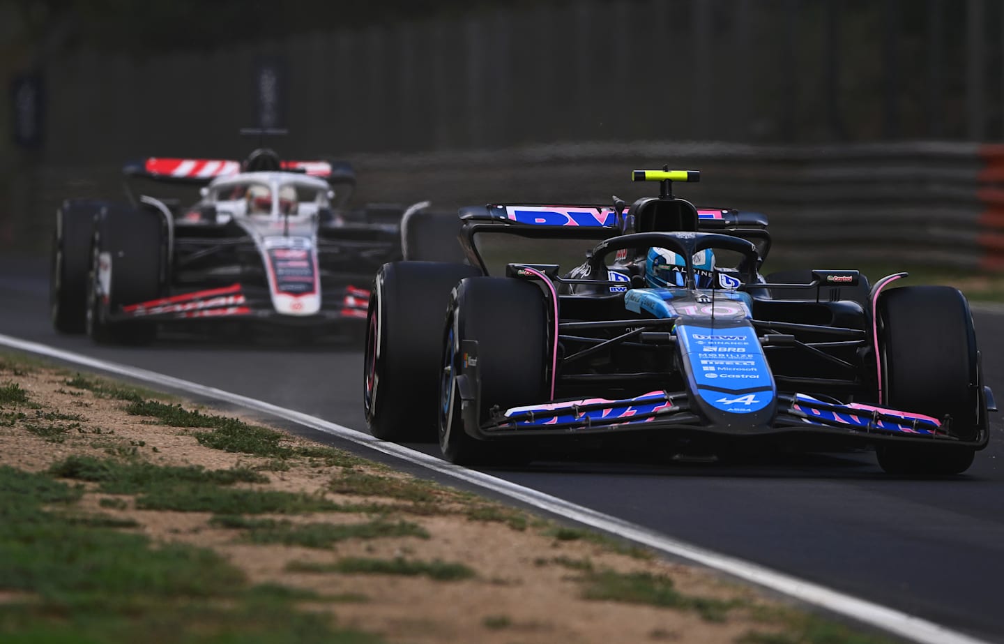 MONZA, ITALY - SEPTEMBER 01: Pierre Gasly of France driving the (10) Alpine F1 A524 Renault leads Kevin Magnussen of Denmark driving the (20) Haas F1 VF-24 Ferrari on track during the F1 Grand Prix of Italy. (Photo by Rudy Carezzevoli/Getty Images)