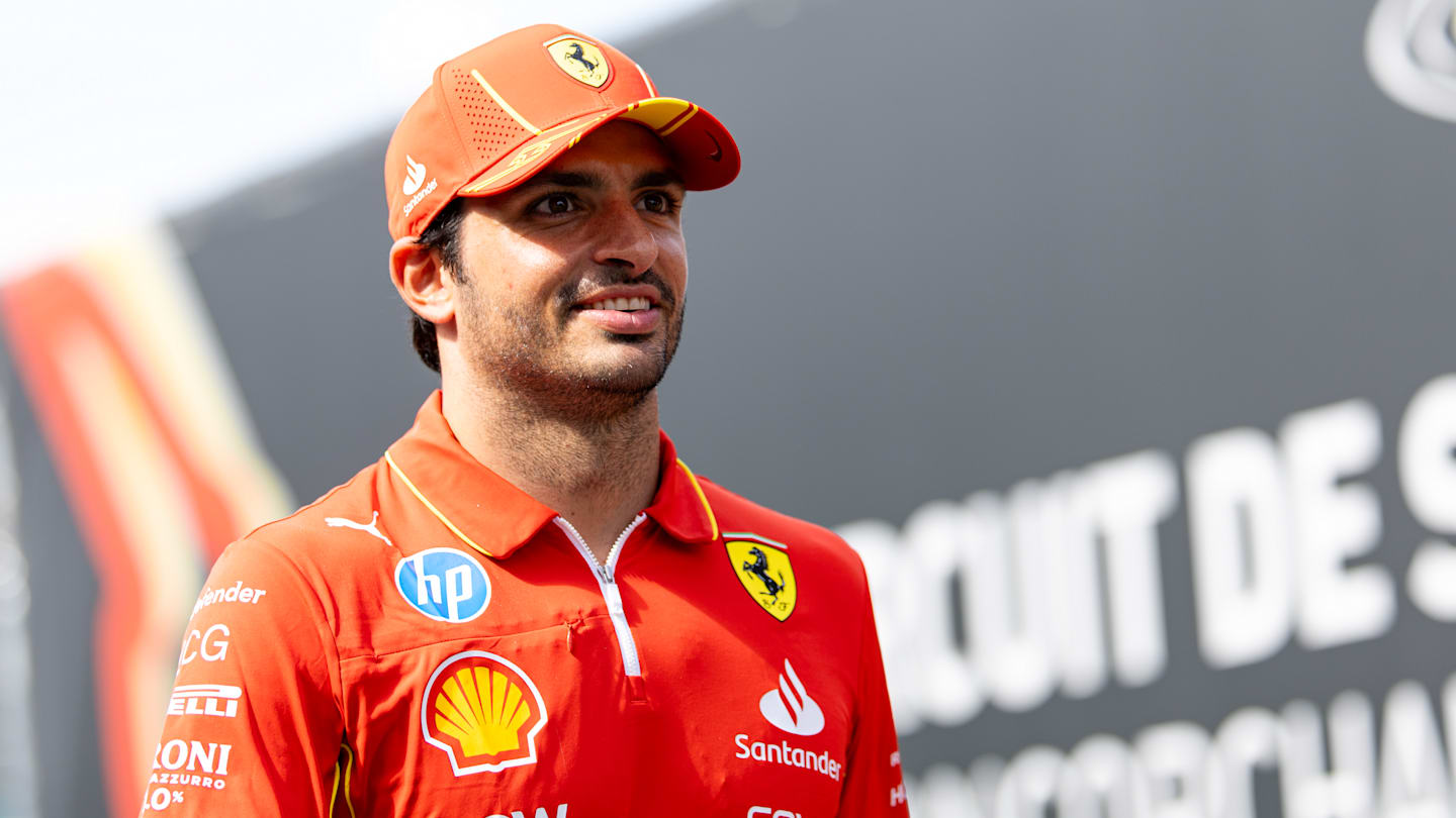 SPA, BELGIUM - JULY 25: Carlos Sainz of Spain and Ferrari smiling in the paddock during previews