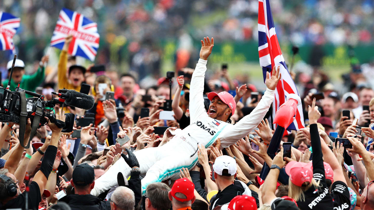 NORTHAMPTON, ENGLAND - JULY 14: Race winner Lewis Hamilton of Great Britain and Mercedes GP