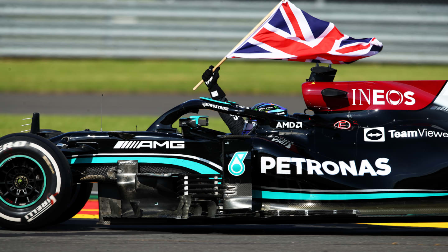 NORTHAMPTON, ENGLAND - JULY 18: Race winner Lewis Hamilton of Great Britain driving the (44)