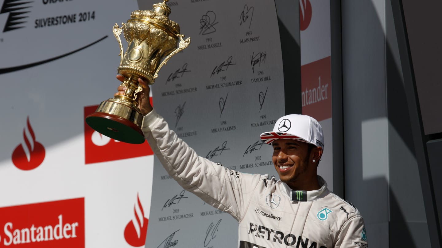 NORTHAMPTON, ENGLAND - JULY 06:  Lewis Hamilton of Great Britain and Mercedes GP celebrates with a