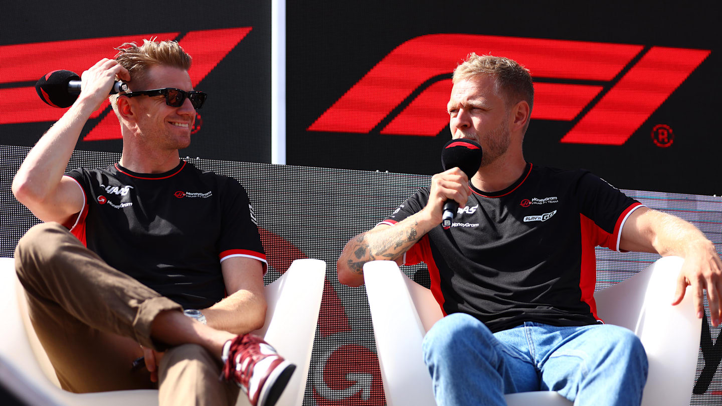 SPIELBERG, AUSTRIA - JUNE 29: Nico Hulkenberg of Germany and Haas F1 and Kevin Magnussen of Denmark