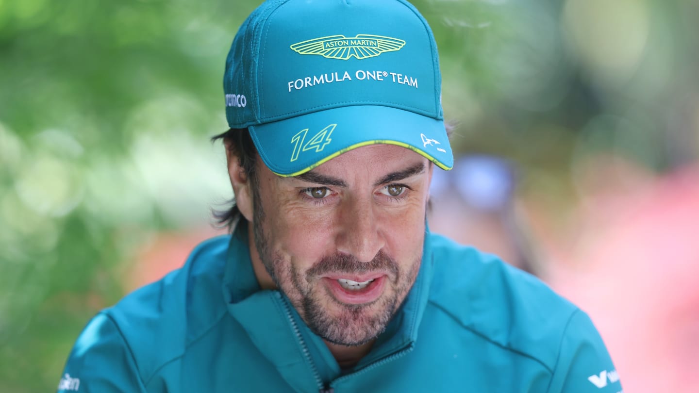 SHANGHAI, CHINA - APRIL 18: Fernando Alonso of Spain and Aston Martin F1 Team walks in the Paddock