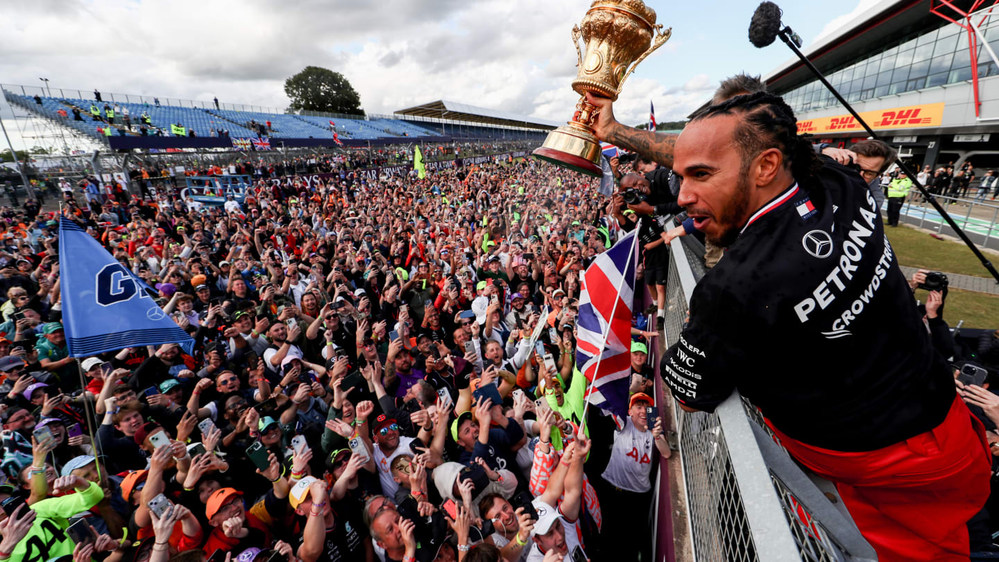 NORTHAMPTON, ENGLAND - JULY 07: Lewis Hamilton of Mercedes and Great Britain celebrates finishing