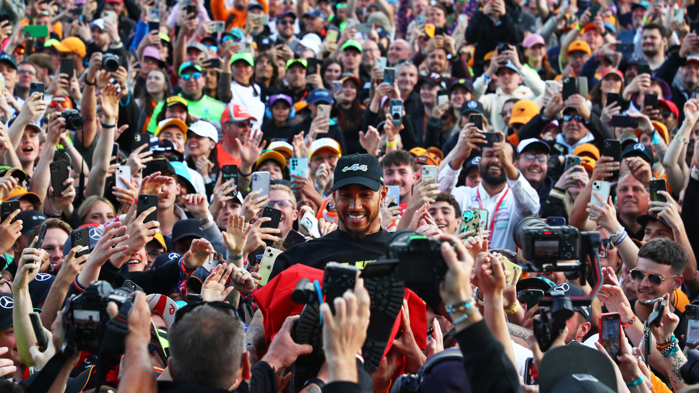 NORTHAMPTON, ENGLAND - JULY 07: Race winner Lewis Hamilton of Great Britain and Mercedes jumps into