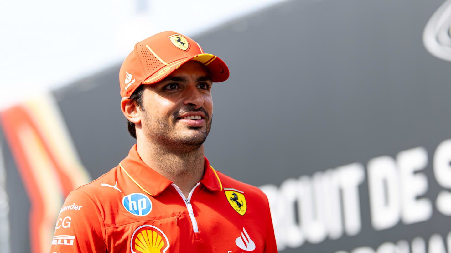 SPA, BELGIUM - JULY 25: Carlos Sainz of Spain and Ferrari smiling in the paddock during previews