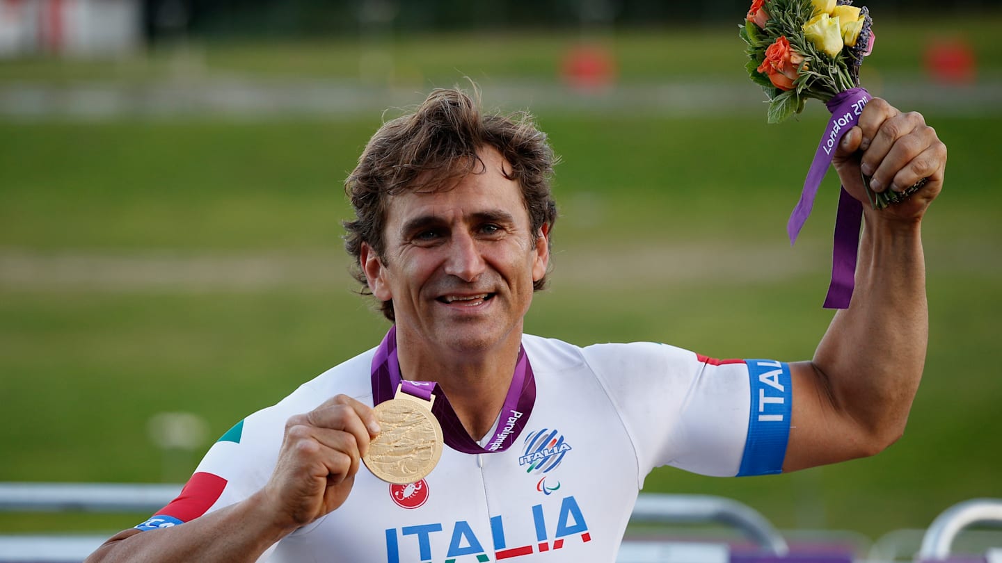 LONGFIELD, ENGLAND - SEPTEMBER 07:  Alessandro Zanardi of Italy poses with his Gold medal after