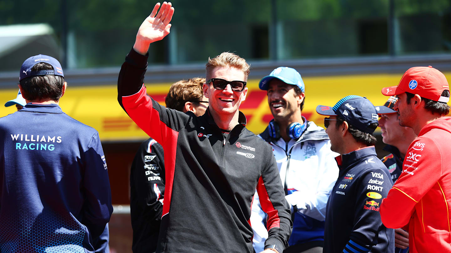 SPA, BELGIUM - JULY 28: Nico Hulkenberg of Germany and Haas F1 waves from the drivers parade prior