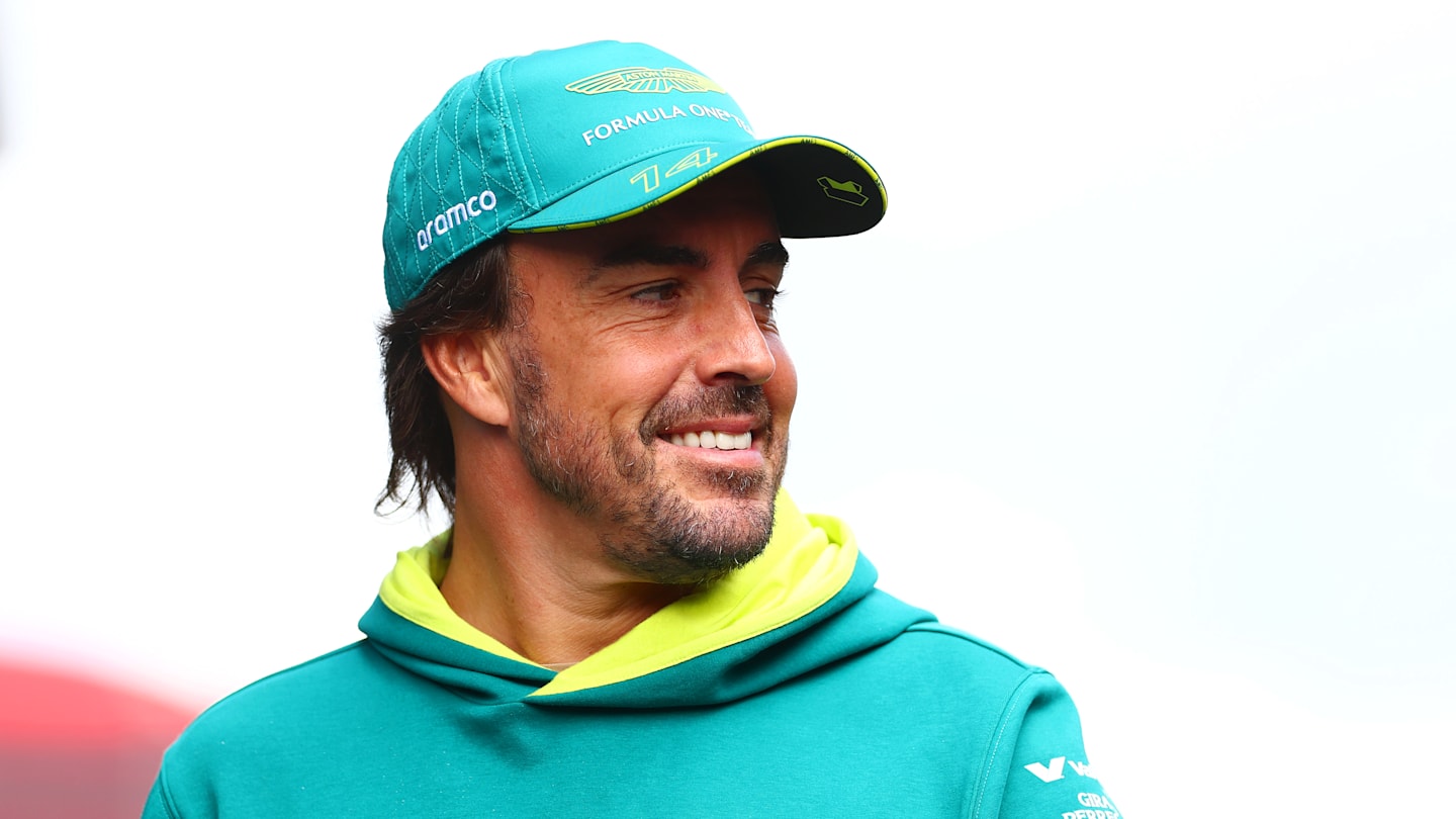 SPA, BELGIUM - JULY 26: Fernando Alonso of Spain and Aston Martin F1 Team walks in the Paddock