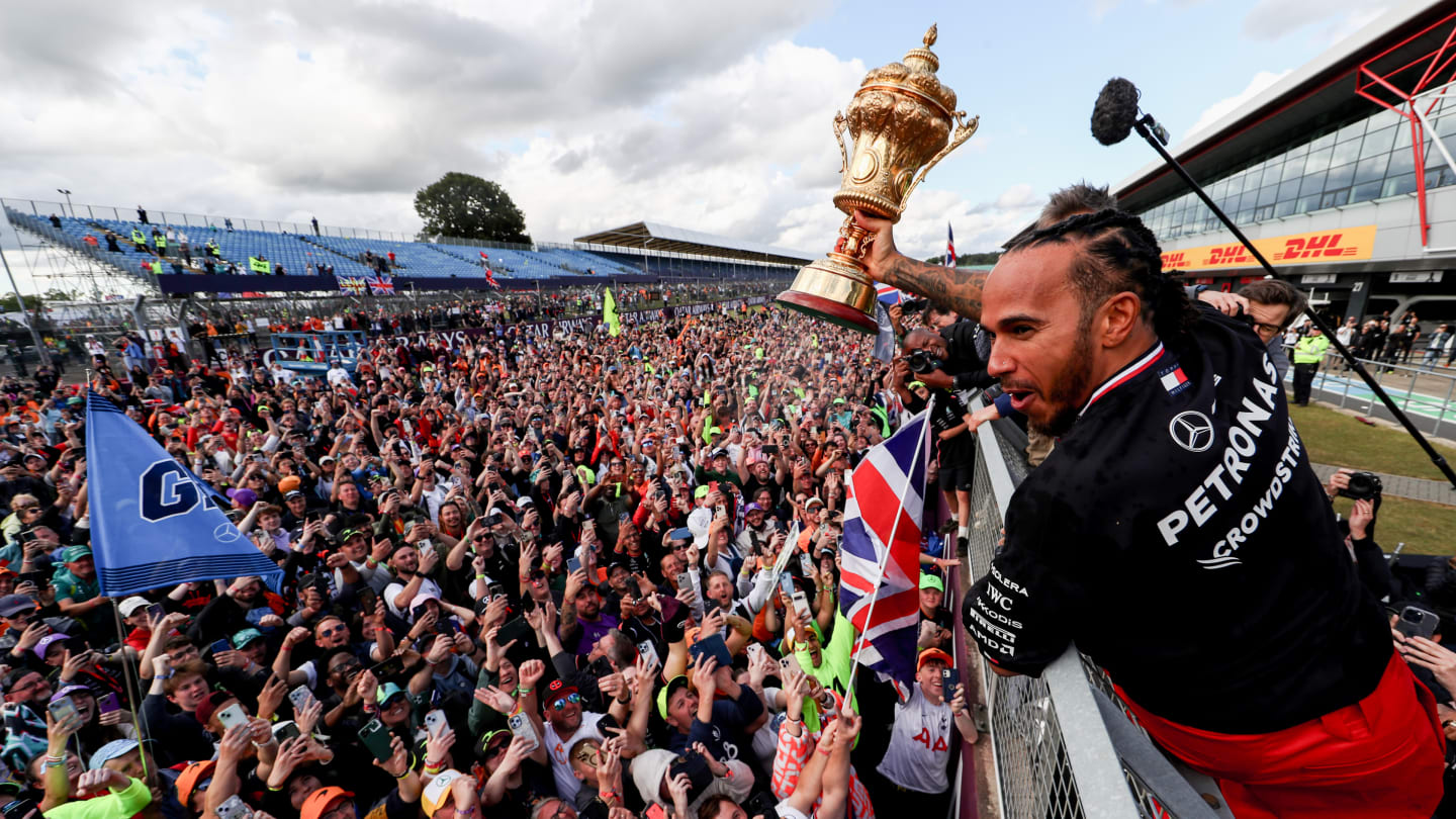 NORTHAMPTON, ENGLAND - JULY 07: Lewis Hamilton of Mercedes and Great Britain celebrates finishing