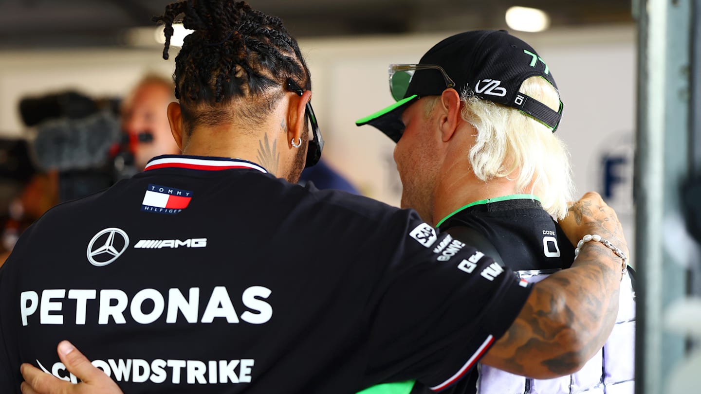 BUDAPEST, HUNGARY - JULY 21: Lewis Hamilton of Great Britain and Mercedes and Valtteri Bottas of