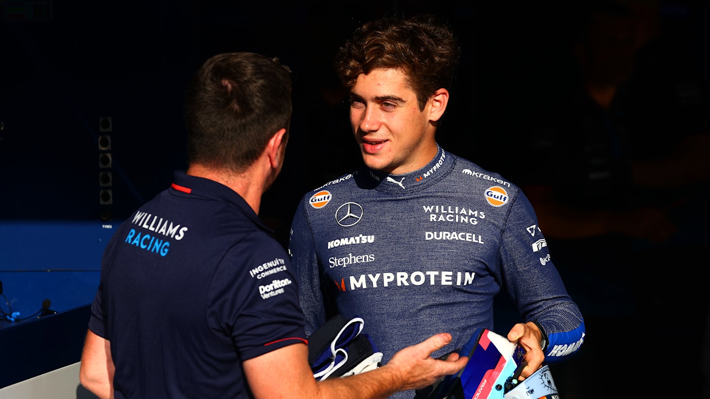 MONZA, ITALY - AUGUST 29: Franco Colapinto of Argentina and Williams talks with a Williams team