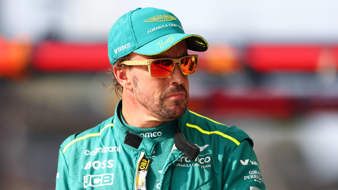 MONZA, ITALY - AUGUST 31: Fernando Alonso of Spain and Aston Martin F1 Team walks in the Pitlane