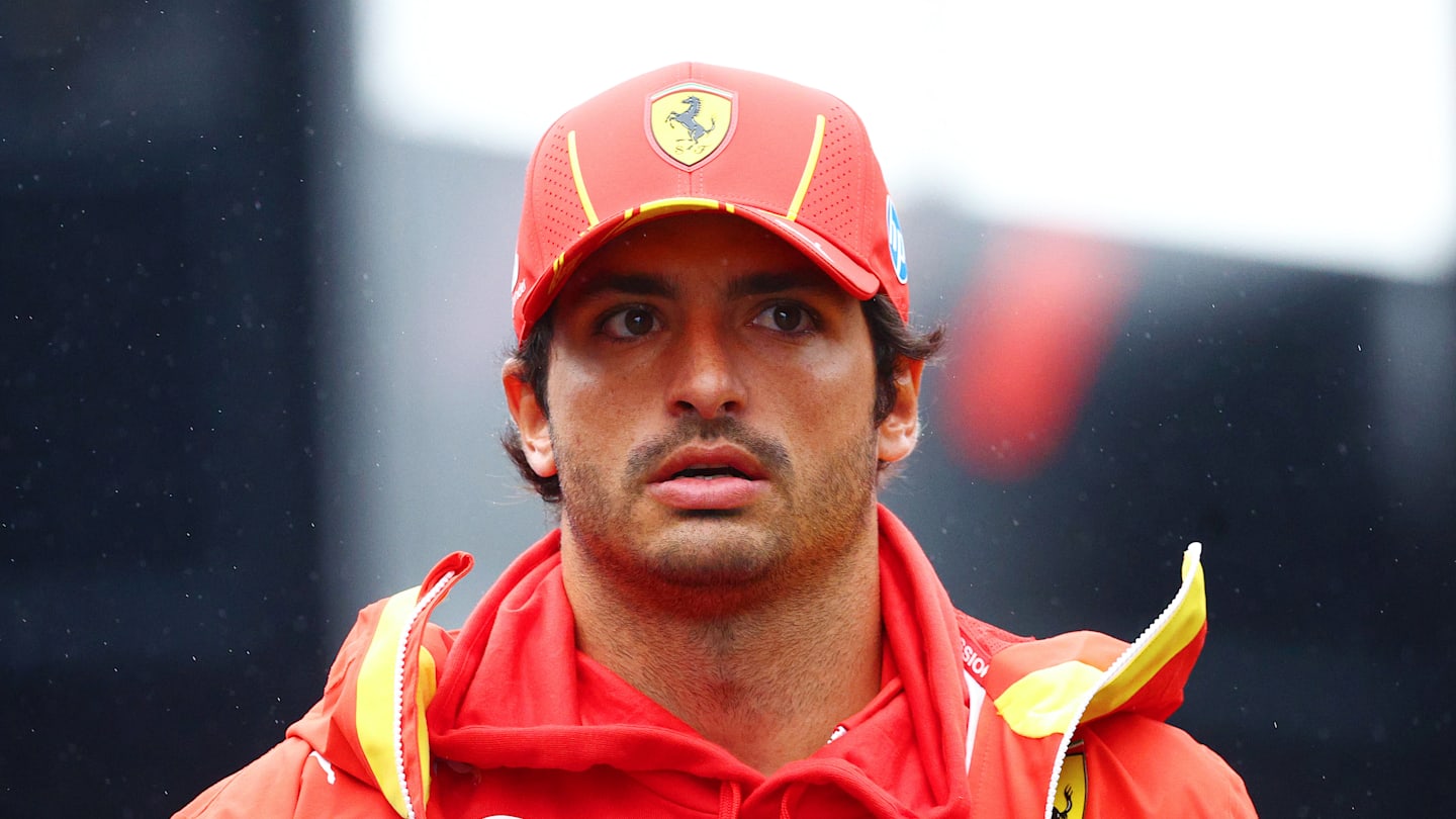 ZANDVOORT, NETHERLANDS - AUGUST 24: Carlos Sainz of Spain and Ferrari walks in the Paddock prior to