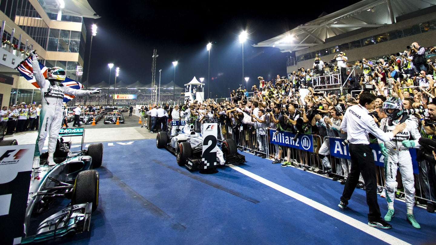 ABU DHABI, UNITED ARAB EMIRATES - NOVEMBER 23:  Lewis Hamilton of Mercedes and Great Britain wins