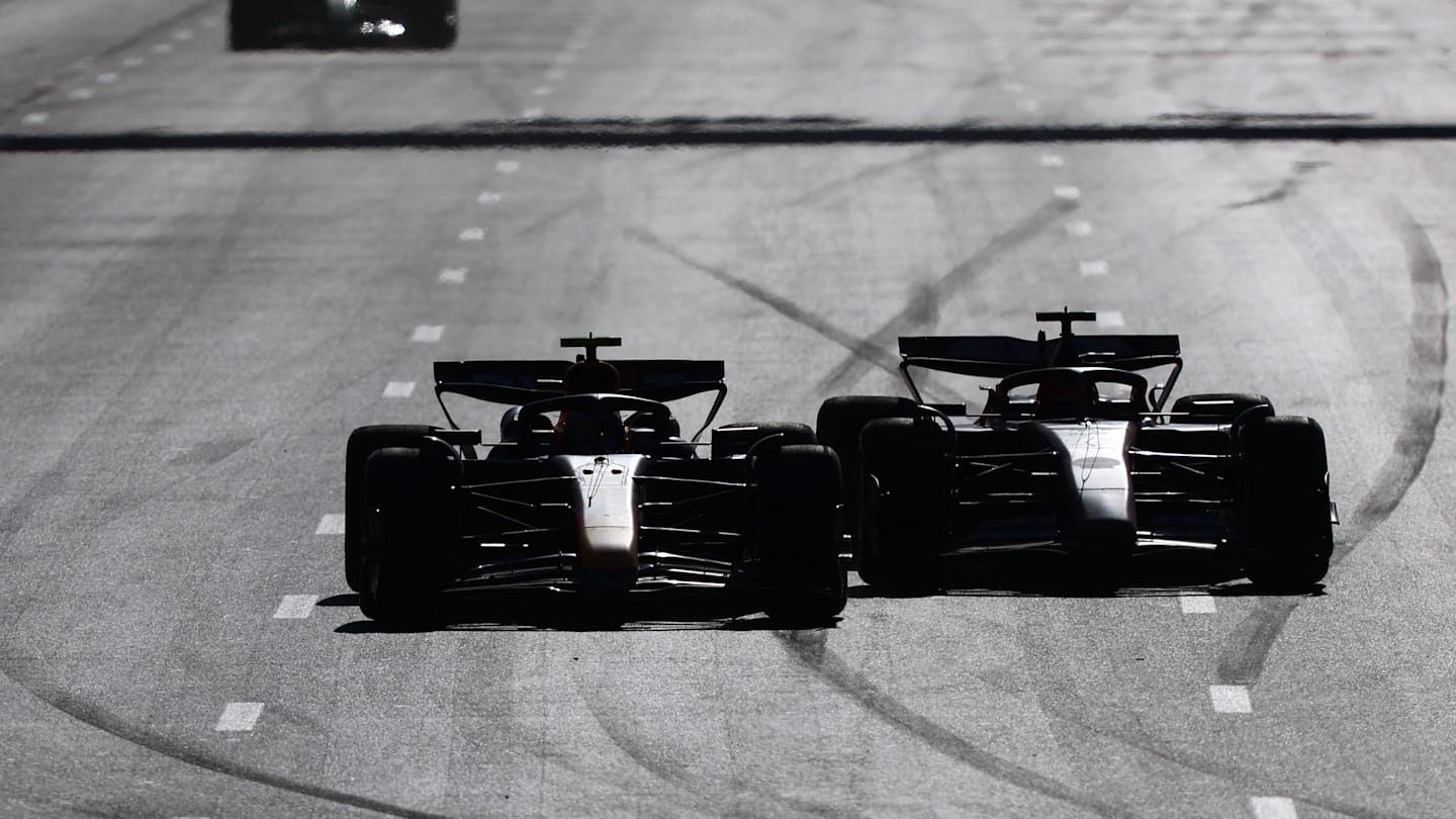 BAKU, AZERBAIJAN - SEPTEMBER 15: Sergio Perez of Mexico driving the (11) Oracle Red Bull Racing RB20 and Charles Leclerc of Monaco driving the (16) Ferrari SF-24 battle for track position during the F1 Grand Prix of Azerbaijan at Baku City Circuit on September 15, 2024 in Baku, Azerbaijan. (Photo by Joe Portlock - Formula 1/Formula 1 via Getty Images)