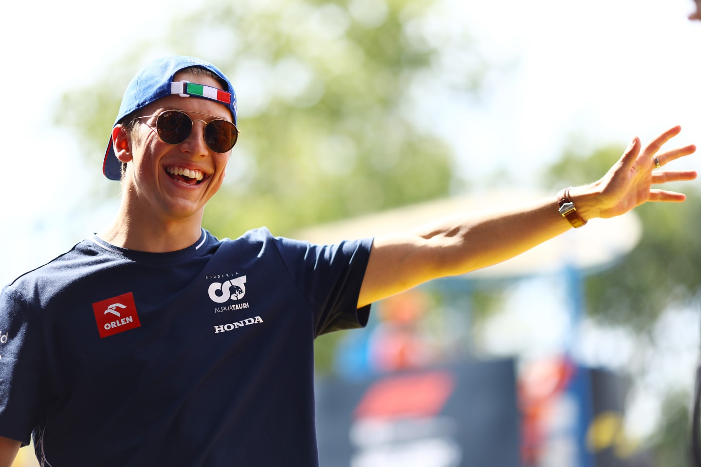 MONZA, ITALY - SEPTEMBER 03: Liam Lawson of New Zealand and Scuderia AlphaTauri waves to the crowd