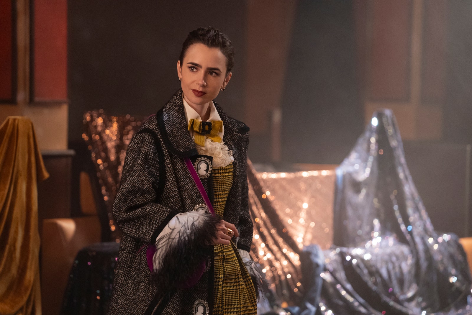 Image may contain Lily Collins Fashion Adult Person Clothing Coat Velvet Cape Performer and Solo Performance